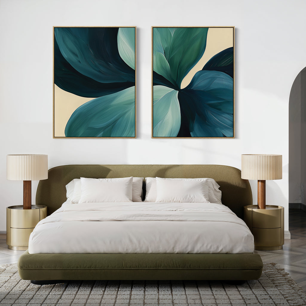 A modern bedroom featuring a low olive-green bed, white bedding, beige nightstands with matching lamps, and the Lush Teal Foliage Set of 2 abstract canvas paintings above the headboard, adding a living room vibe.
