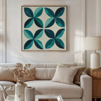 A modern living room with a beige sofa, neutral pillows, a wooden side table with a ceramic lamp, dried flowers in a vase, and the Marine Mosaic Canvas Art featuring an abstract teal and turquoise petal design above the sofa.