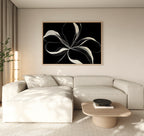 A modern living room features a beige sectional sofa, light wood coffee table, and the Midline Motion Canvas Art as minimalist wall decor. Soft natural light filters through beige curtains, while a tall plant enhances the contemporary space.