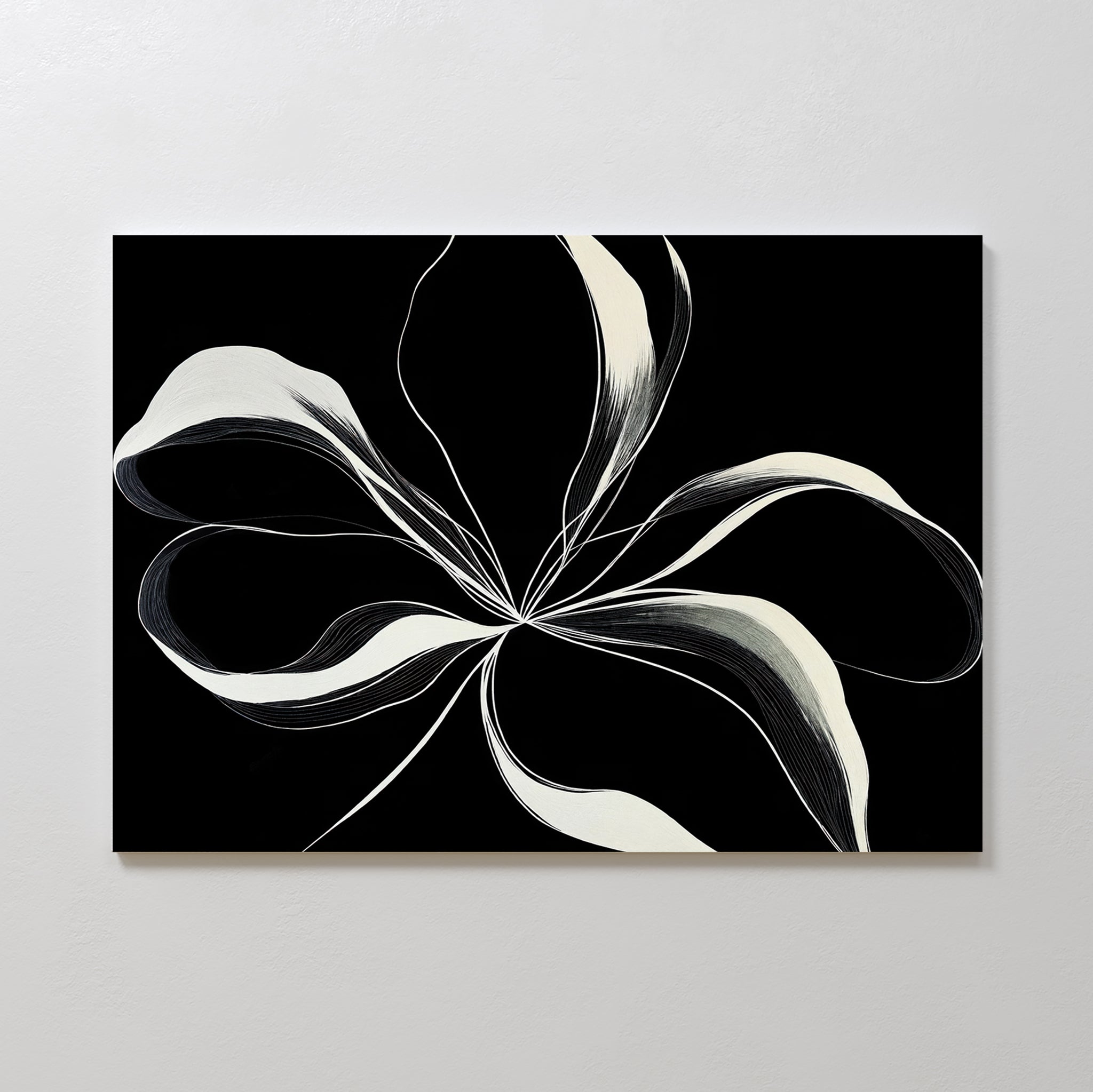 Midline Motion Canvas Art features white, flowing ribbons radiating from a central point on a black background, forming a floral-like shape—ideal as large wall art for modern living room decor.
