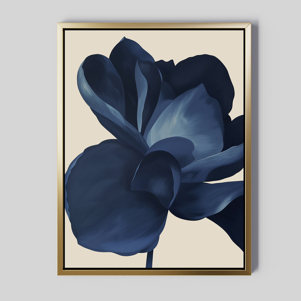 Midnight Bloom Abstract Canvas Art features a large, abstract dark blue flower with soft, layered petals on a light beige background in a sleek gold frame—perfect minimalist wall decor for modern spaces.