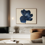 A modern living room with the Midnight Bloom Canvas Art – Horizontal, a beige curved sofa, a marble shelf holding a vase of dried branches, and minimalist decor for a touch of contemporary sophistication.