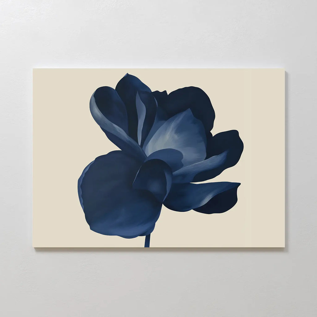 The Midnight Bloom Canvas Art – Horizontal features a single dark blue flower with layered petals on a light beige background, adding modern sophistication and minimalist style to any space.