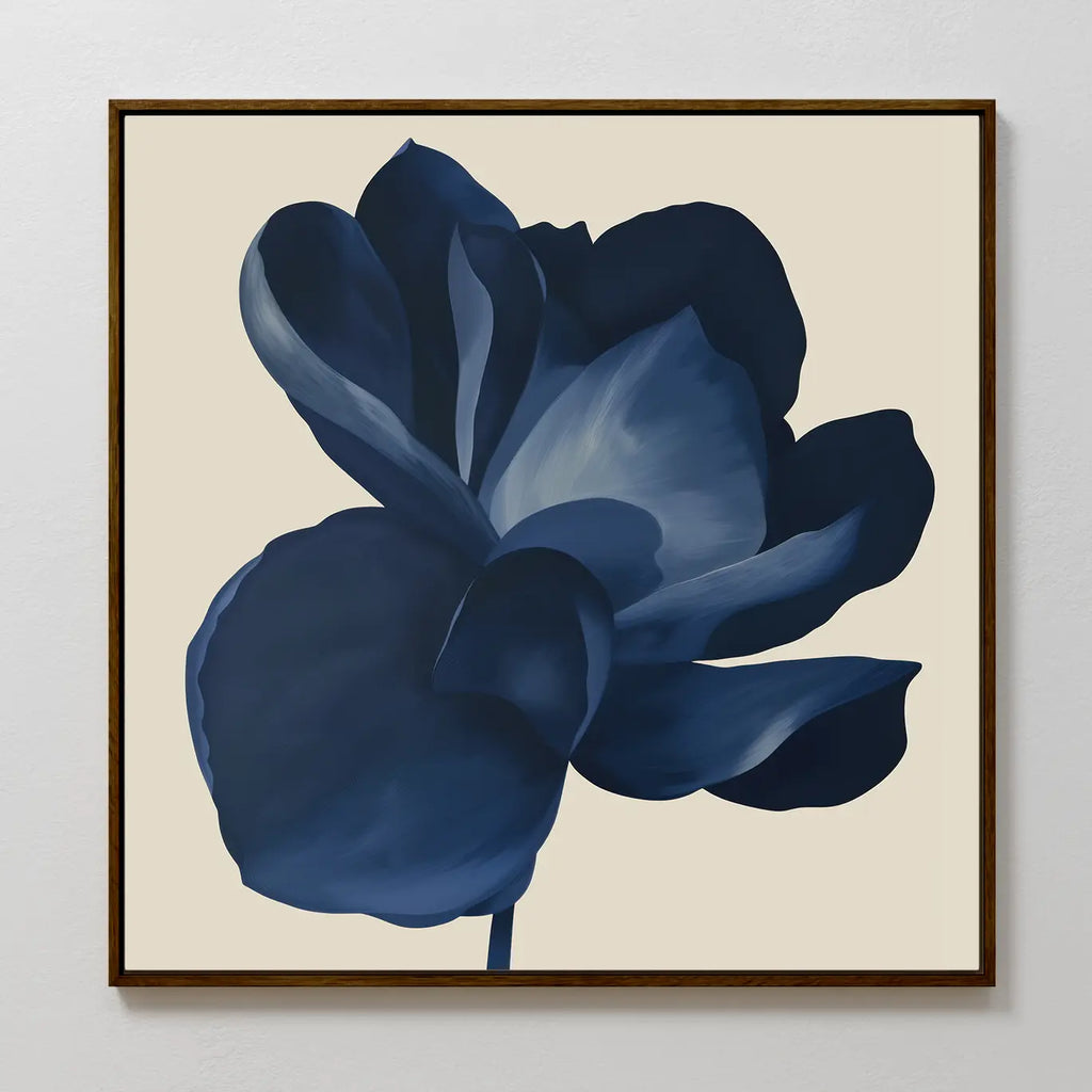 The Midnight Bloom Canvas Art – Square features a large, dark blue flower with layered petals on a beige background, creating a minimalistic and modern focal point perfect for display on a white wall.