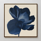 The Midnight Bloom Canvas Art – Square features a large, dark blue flower with layered petals on a beige background, creating a minimalistic and modern focal point perfect for display on a white wall.