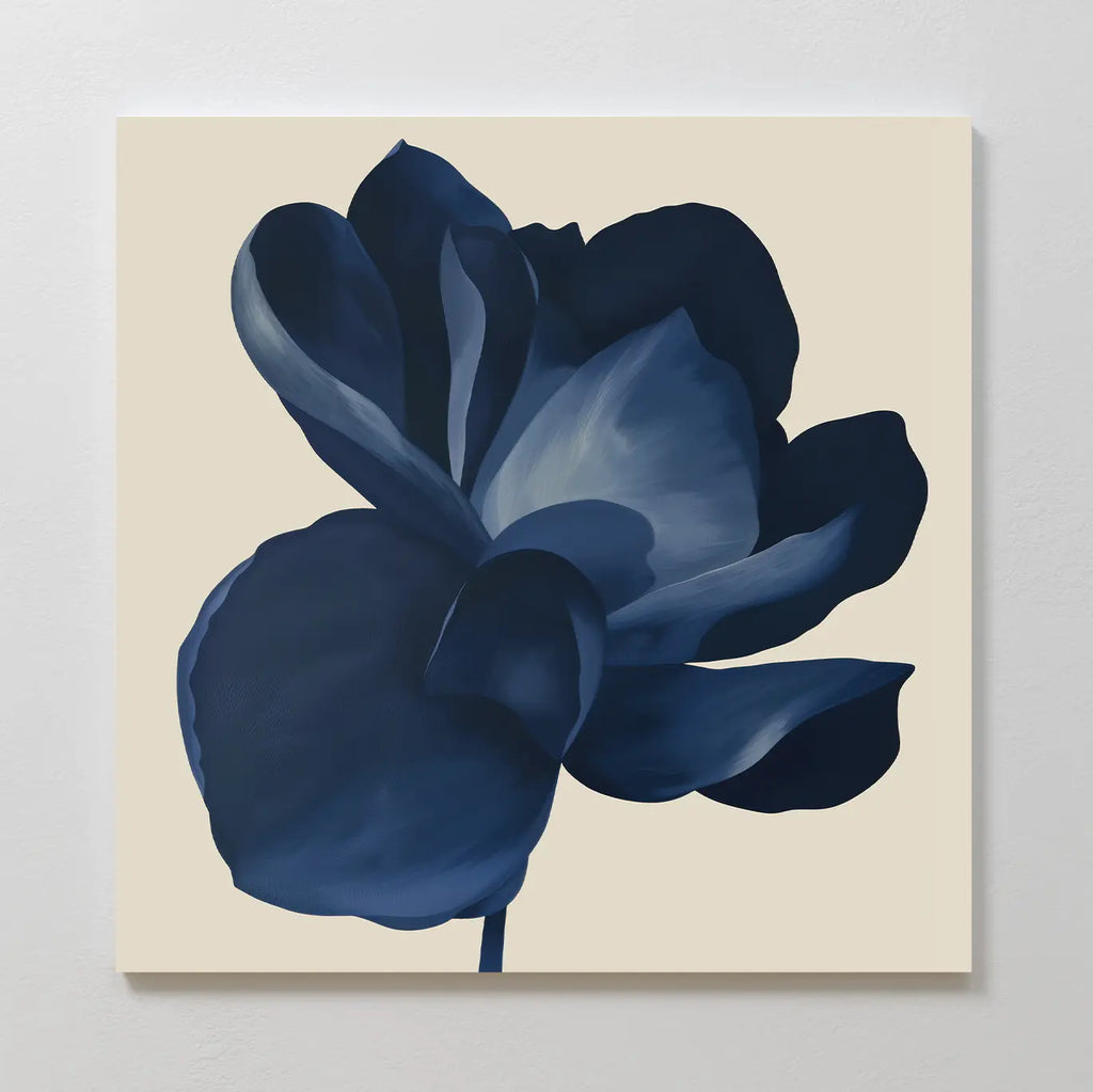 The Midnight Bloom Canvas Art – Square features a single dark blue flower with broad petals on a plain, light beige background, creating striking minimalist wall décor.