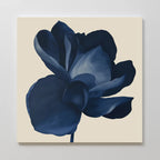 The Midnight Bloom Canvas Art – Square features a single dark blue flower with broad petals on a plain, light beige background, creating striking minimalist wall décor.