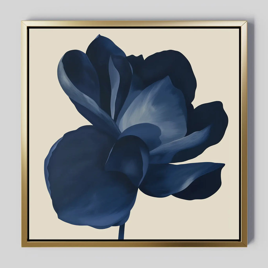 The Midnight Bloom Canvas Art – Square features a single dark blue flower with large petals on a light beige background, framed in metallic gold for a modern and elegant minimalist wall art statement.
