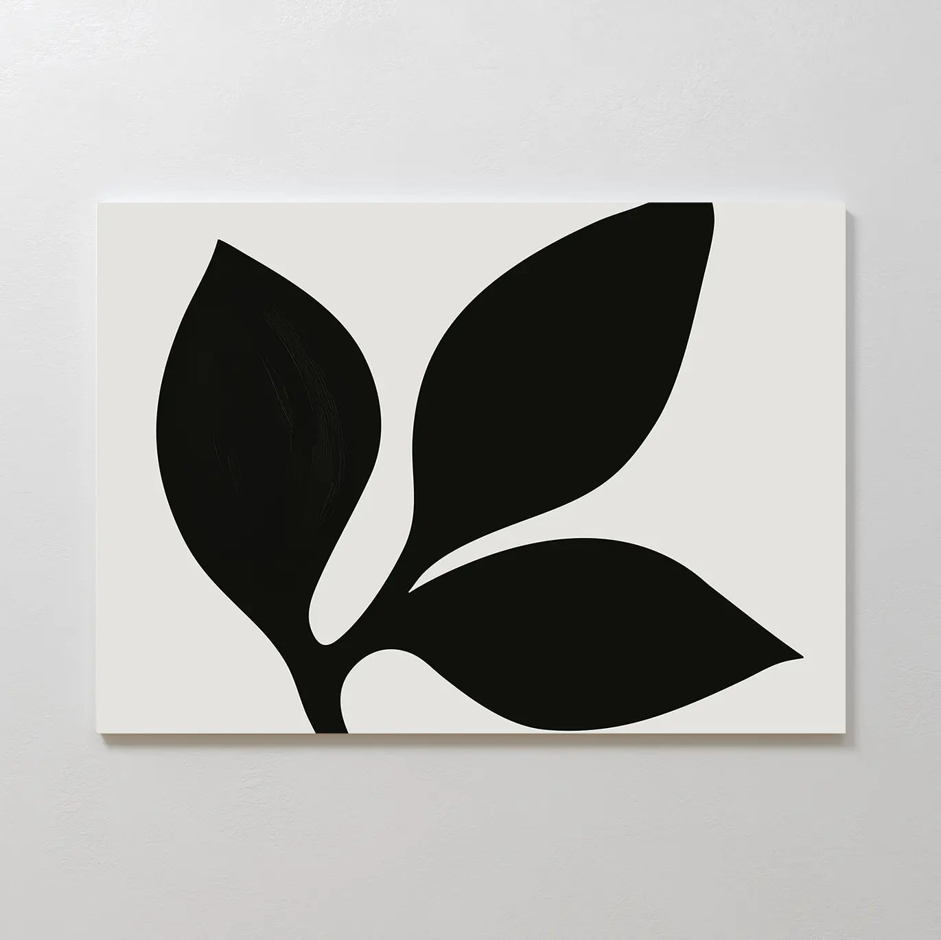 The Midnight Botanist Canvas Art showcases a minimalist white canvas with a striking black plant silhouette of three bold leaves, ideal as botanical wall art or stylish living room decor on light-colored walls.