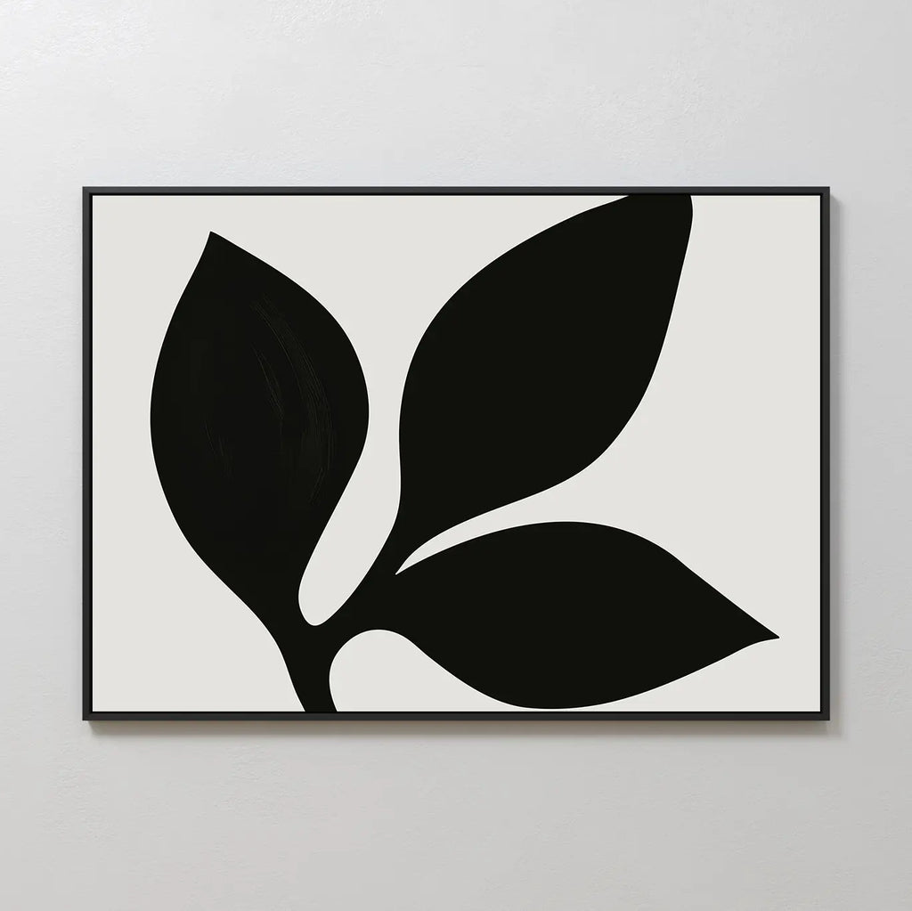 Midnight Botanist Canvas Art showcases a black abstract plant with three bold leaves on a white background, set in a slim black frame—ideal botanical wall art for modern living room decor.