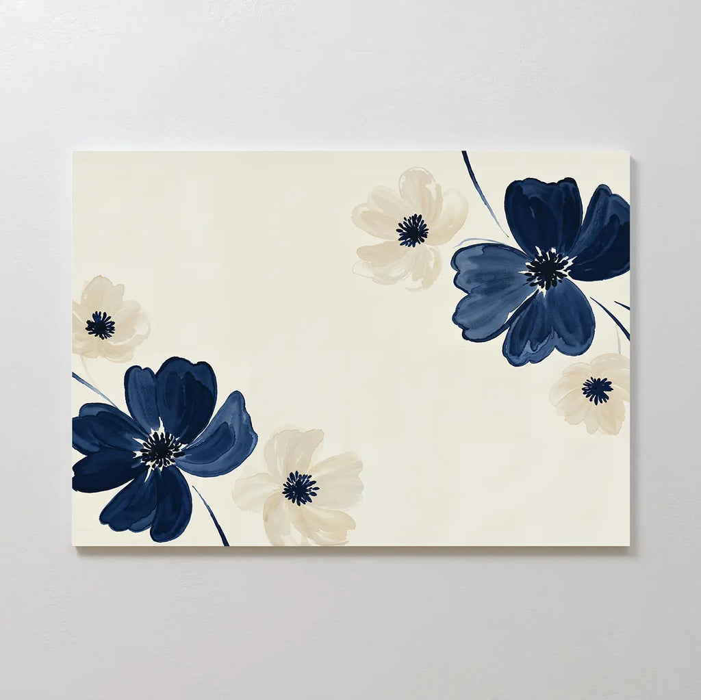 The Midnight Garden Canvas Art features a minimalist floral design with large navy blue and cream flowers on a light beige background, adding modern abstract flair to your wall decor.