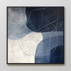 Midnight Lines Abstract Canvas Art features navy blue, white, and gray geometric shapes intersected by thin, curved white lines. Framed in black, this elegant piece is ideal for adding modern style to your living room walls.