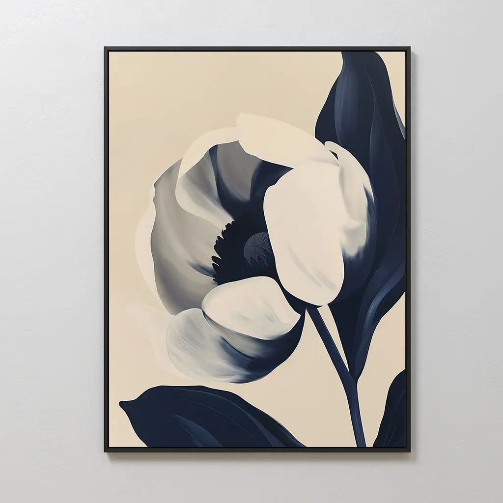 Midnight Tulip Canvas Art: A minimalist floral canvas featuring a large tulip with dark blue and white petals on a light beige background, framed in black—an elegant botanical wall art piece perfect for living room decor.