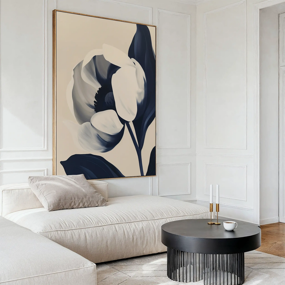 A modern living room features white paneled walls, a white sectional sofa with beige cushions, and minimal decor. The highlight is the large Midnight Tulip Canvas Art above the sofa, complemented by a round black coffee table with candles and a cup.