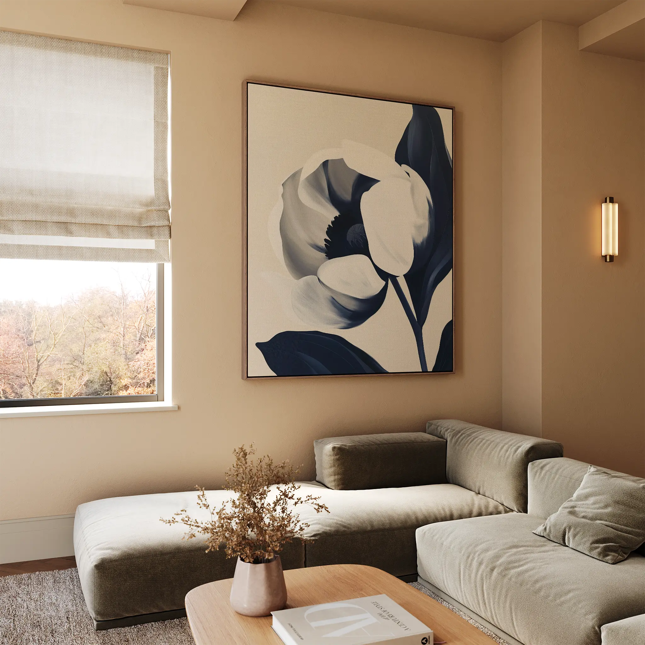 A modern living room with neutral tones features the Midnight Tulip Canvas Art on the wall, a beige sectional sofa, a wooden coffee table with a vase of dried flowers, and a window with a Roman shade.
