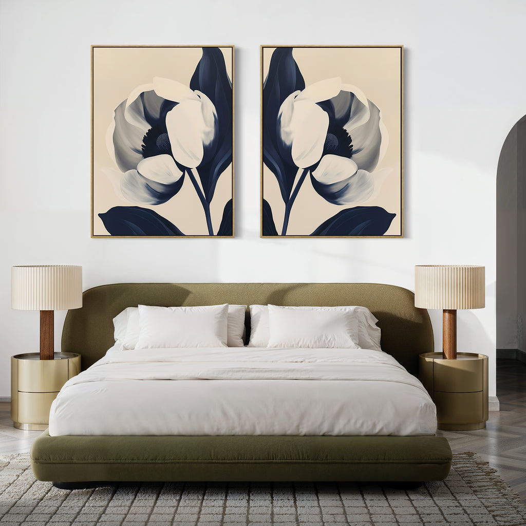 A modern bedroom with a low olive green bed, white bedding, matching round nightstands, two beige lamps, and the Midnight Tulip Set of 2 botanical wall art above the headboard on a white wall.