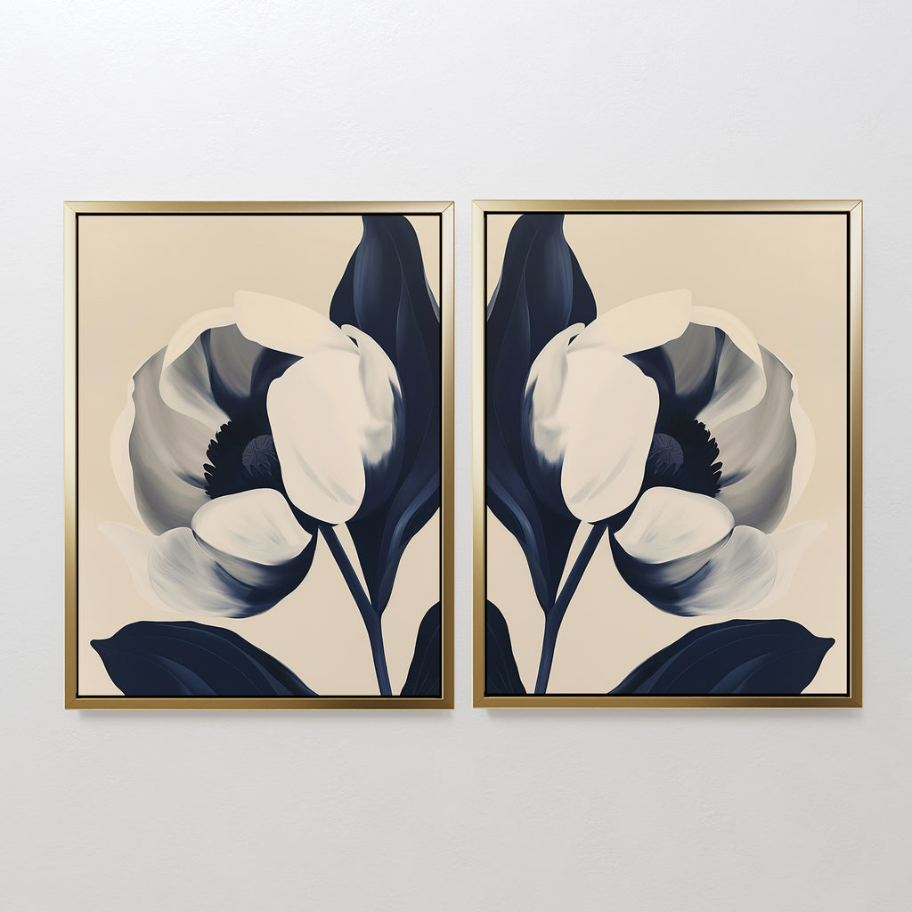 The Midnight Tulip Set of 2 features framed prints of abstract flowers with large white petals and dark blue leaves, set against soft neutral backgrounds for a minimalistic, modern botanical wall art display.