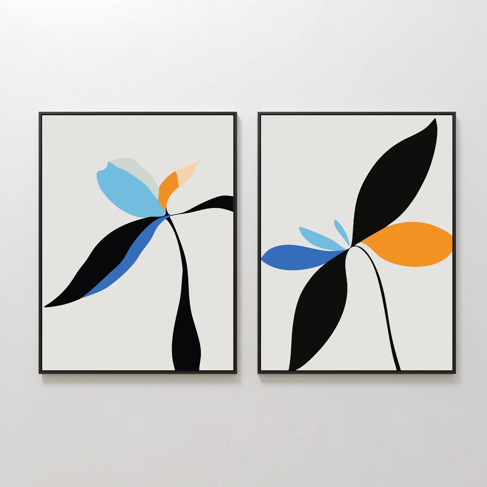 The Minimal Flora Set of 2 features framed abstract floral prints with minimalist plant shapes in black, blue, orange, and light green on a light background—perfect as modern wall decor for a white wall.