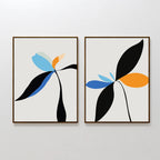 The Minimal Flora Set of 2 includes framed abstract floral prints with stylized plants in black, blue, orange, and pale green on a light background—ideal modern wall decor to refresh any space.