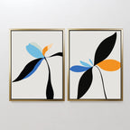 The Minimal Flora Set of 2 features framed abstract floral prints with black stems and blue, orange, and light leaves on white backgrounds, offering striking modern wall decor when displayed side by side.
