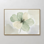 The Mint Meadow Canvas Art is a framed minimalist wall piece featuring a large watercolor flower with soft green and cream petals on a light, abstract background.