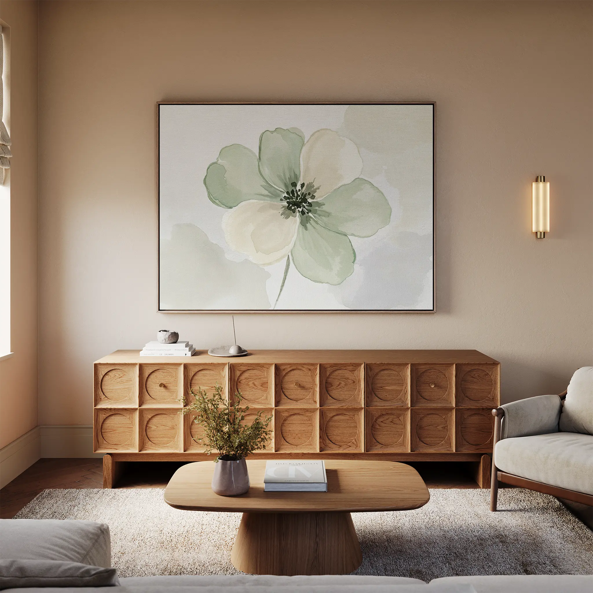 A modern living room with a wooden sideboard with geometric patterns, a coffee table, light sofa, beige rug, and the Mint Meadow Canvas Art in green and white tones adorning the wall.