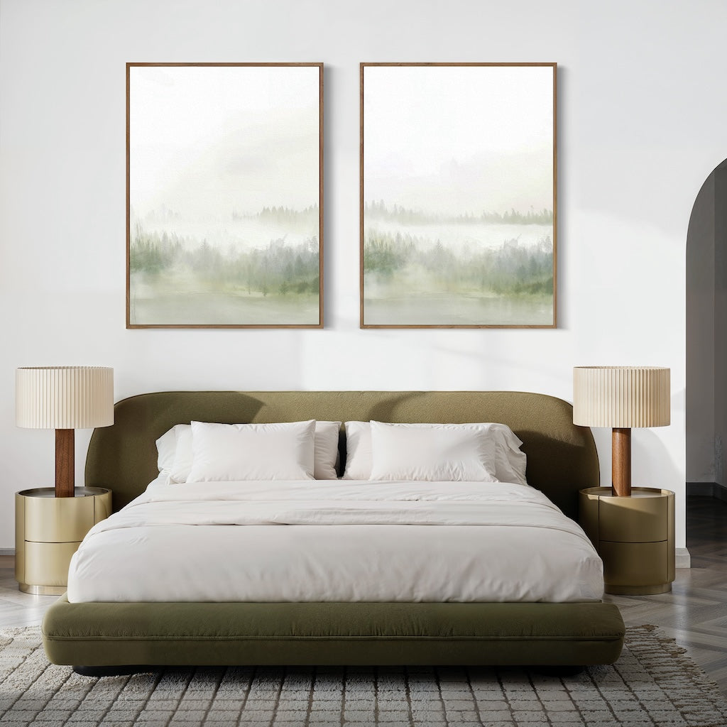 A modern bedroom with a low olive green bed, white bedding, and beige nightstands. Matching lamps and the Misty Forest Set of 2 paintings above the bed create a peaceful retreat, completed by minimal decor and a soft rug.