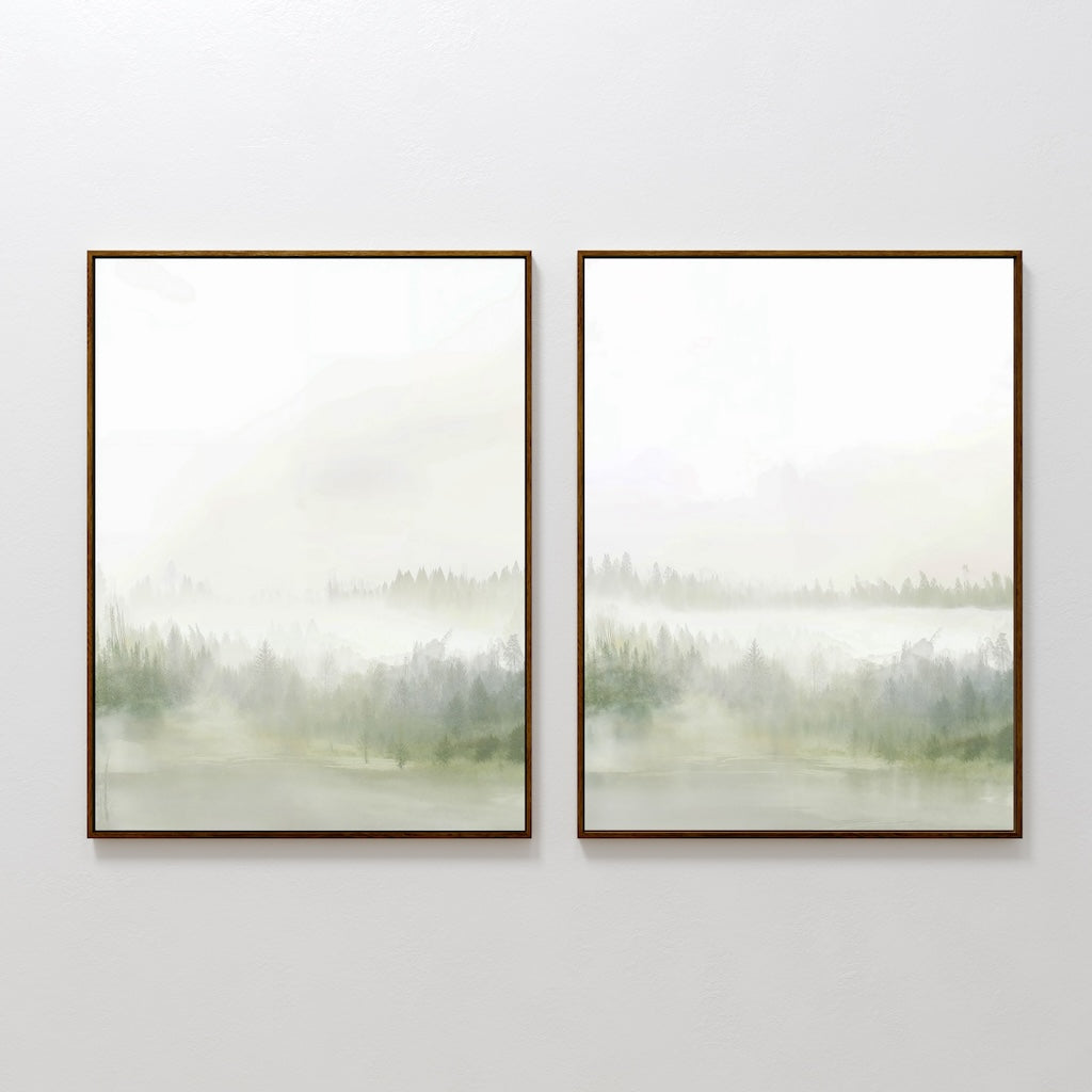The Misty Forest Set of 2 features two framed prints side by side on a white wall, each with a minimalist, misty landscape in soft green and gray tones and faint tree outlines, evoking calm and serenity.
