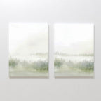 The Misty Forest Set of 2 features minimalist paintings side by side, each showing a misty forest landscape with soft green trees fading into a foggy, light background.