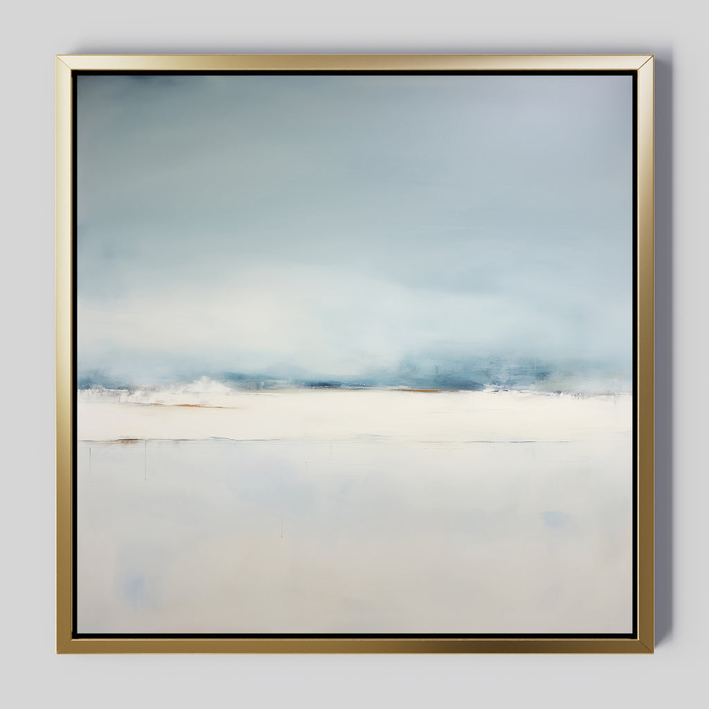 The Misty Morning Abstract Canvas Art features soft blue and white tones in a minimalist design, evoking a serene, foggy landscape. Finished with a gold frame, it adds calm and neutral elegance to your home decor.
