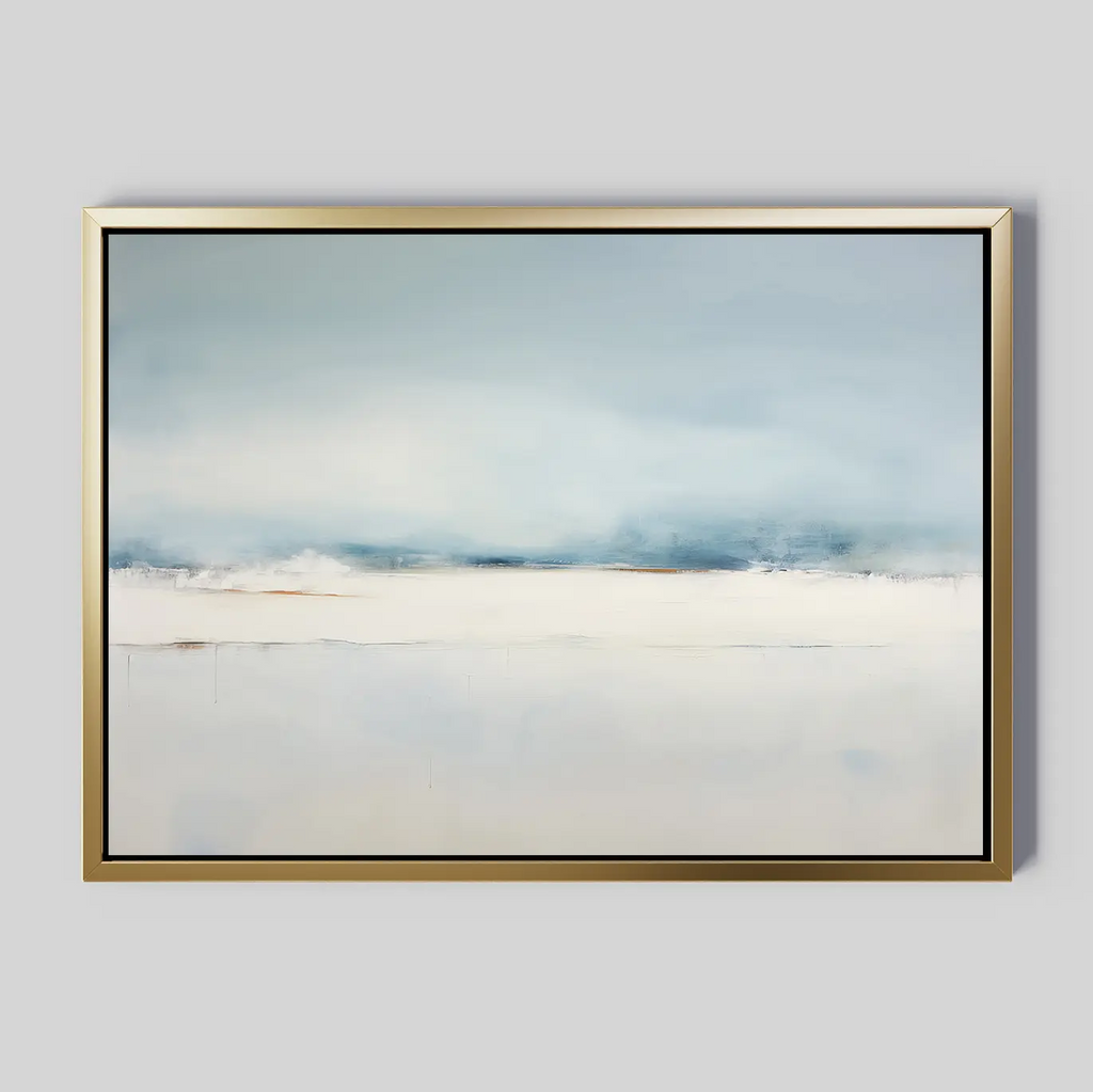 The Misty Morning Canvas Art – Horizontal features abstract, soft blended blues, whites, and grays that evoke a serene landscape. Framed in sleek gold with a light gray background, this minimalist wall art adds an elegant touch to any space.