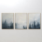 The Misty Pines Set of 3 features framed paintings of a misty Nordic park with tall pine trees fading into a pale sky, creating minimalist and tranquil wall art that brings a cohesive landscape to your space.