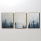 The Misty Pines Set of 3 features framed artworks of dark evergreen trees fading into a foggy sky, creating minimalist wall art perfect for any Nordic Park-inspired space.
