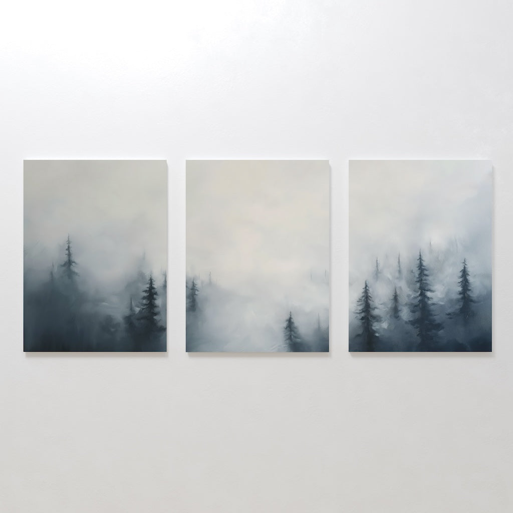 The Misty Pines Set of 3 features minimalist paintings side by side, each showcasing a Nordic park with evergreen trees fading into a foggy grayscale background, creating an elegant and soothing large wall art set.