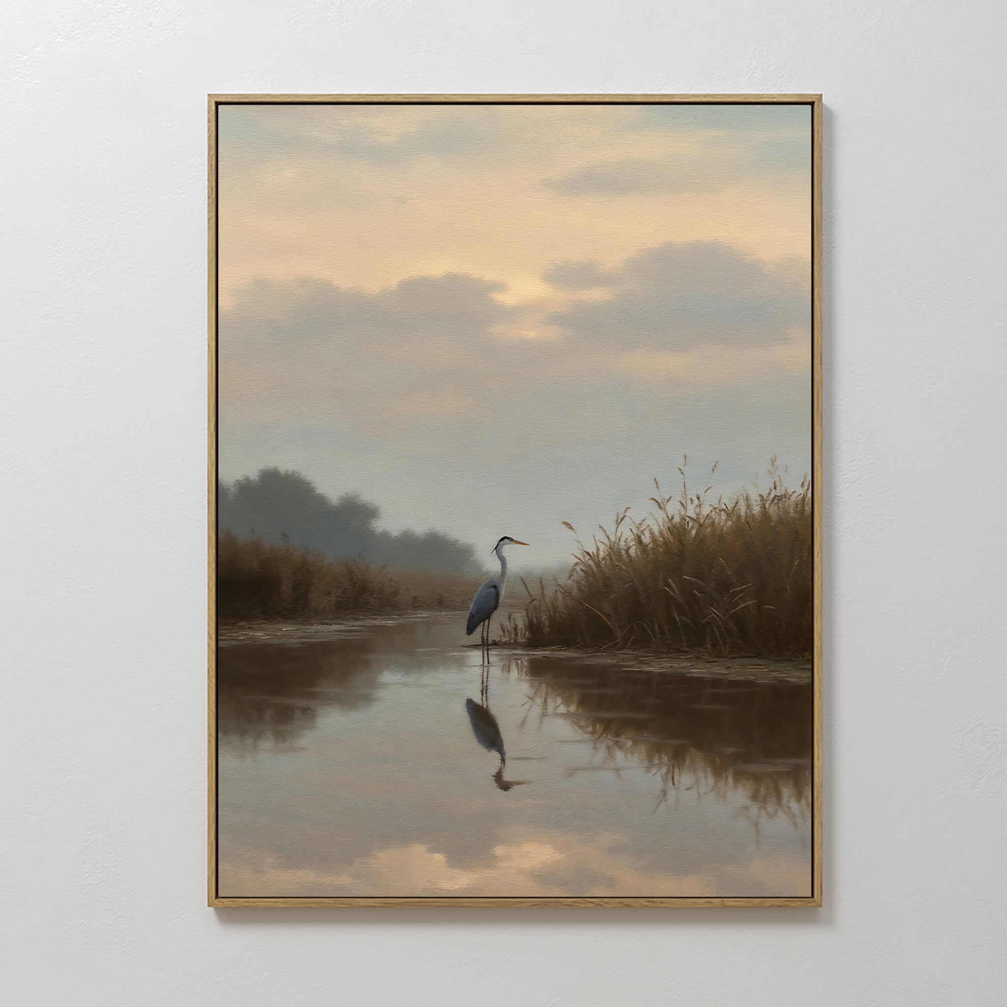 The Misty Reflection Canvas Art features a heron standing in shallow water at sunset, surrounded by grasses and trees. Soft clouds and muted colors create a peaceful scene, making it perfect wall art for a calming atmosphere.