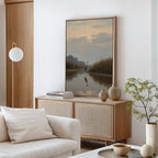 A minimal living room with a light wood sideboard, Misty Reflection Canvas Art featuring a heron by water, neutral decor, a white sofa with cushions, a small green plant, and soft natural lighting.
