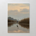 The Misty Reflection Canvas Art features a heron in shallow water at sunrise, surrounded by tall grasses and soft clouds—an ideal Nordic wall art piece to add tranquil beauty and calm reflections to any space.