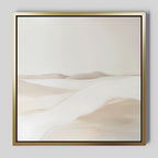 The Misty Vale Abstract Canvas Art features a minimalist painting of sand dunes in soft beige and white tones, framed with a thin gold border. Its smooth lines create a serene landscape—ideal wall art for bedrooms or living rooms.