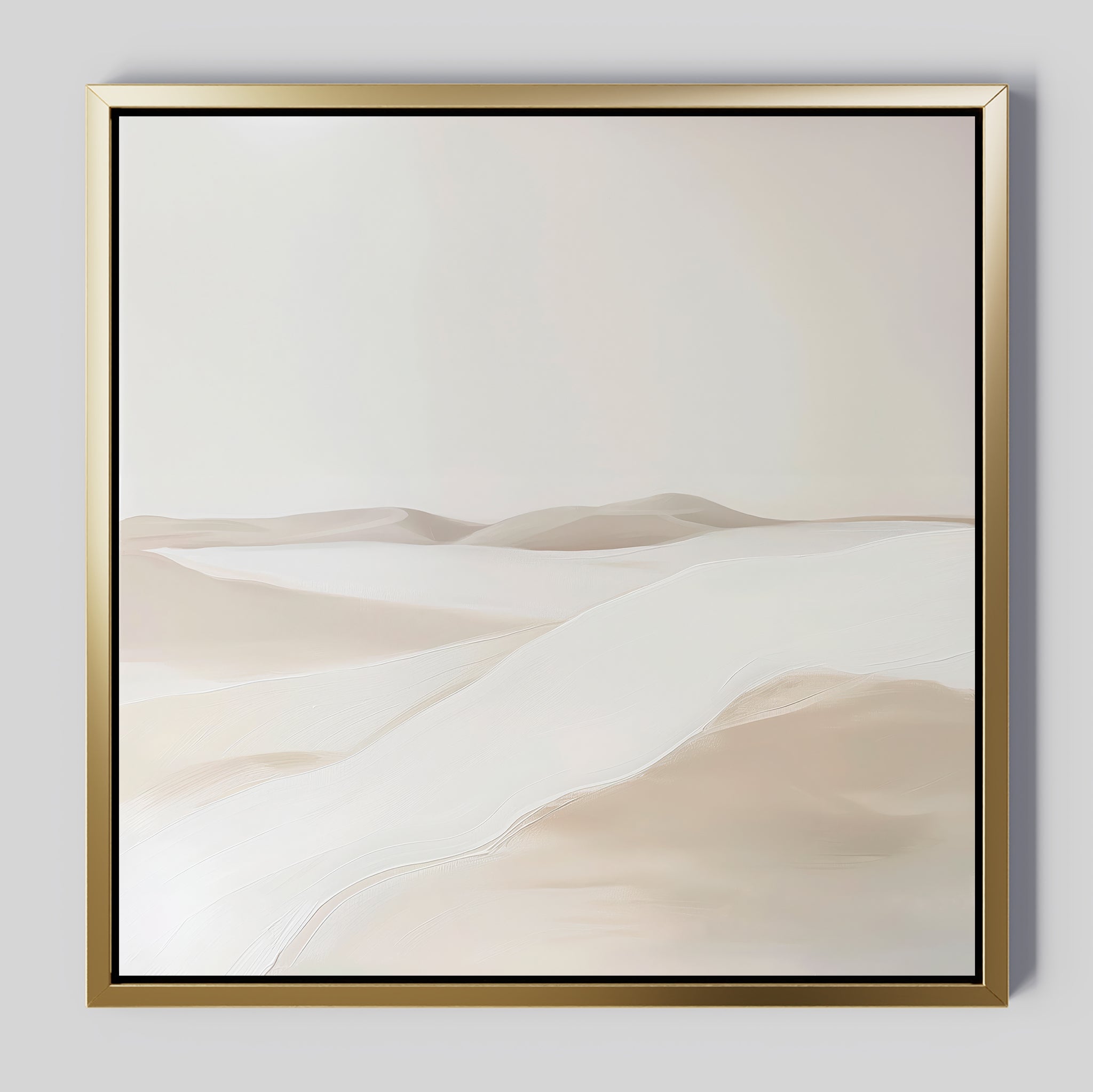 The Misty Vale Abstract Canvas Art features a minimalist painting of sand dunes in soft beige and white tones, framed with a thin gold border. Its smooth lines create a serene landscape—ideal wall art for bedrooms or living rooms.