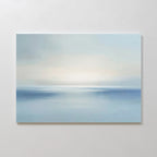 Misty Waters Canvas Art features a minimalist seascape in soft blue and white, with a subtle horizon and gentle light, creating serene wall art that evokes peace and tranquility—ideal for modern wall decor.
