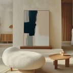 A modern living room with a curved white textured sofa, a small wooden coffee table topped with heart-shaped decor, and the Modern Contrast Abstract Canvas Art featuring dark and light geometric shapes on a stand against a textured wall.