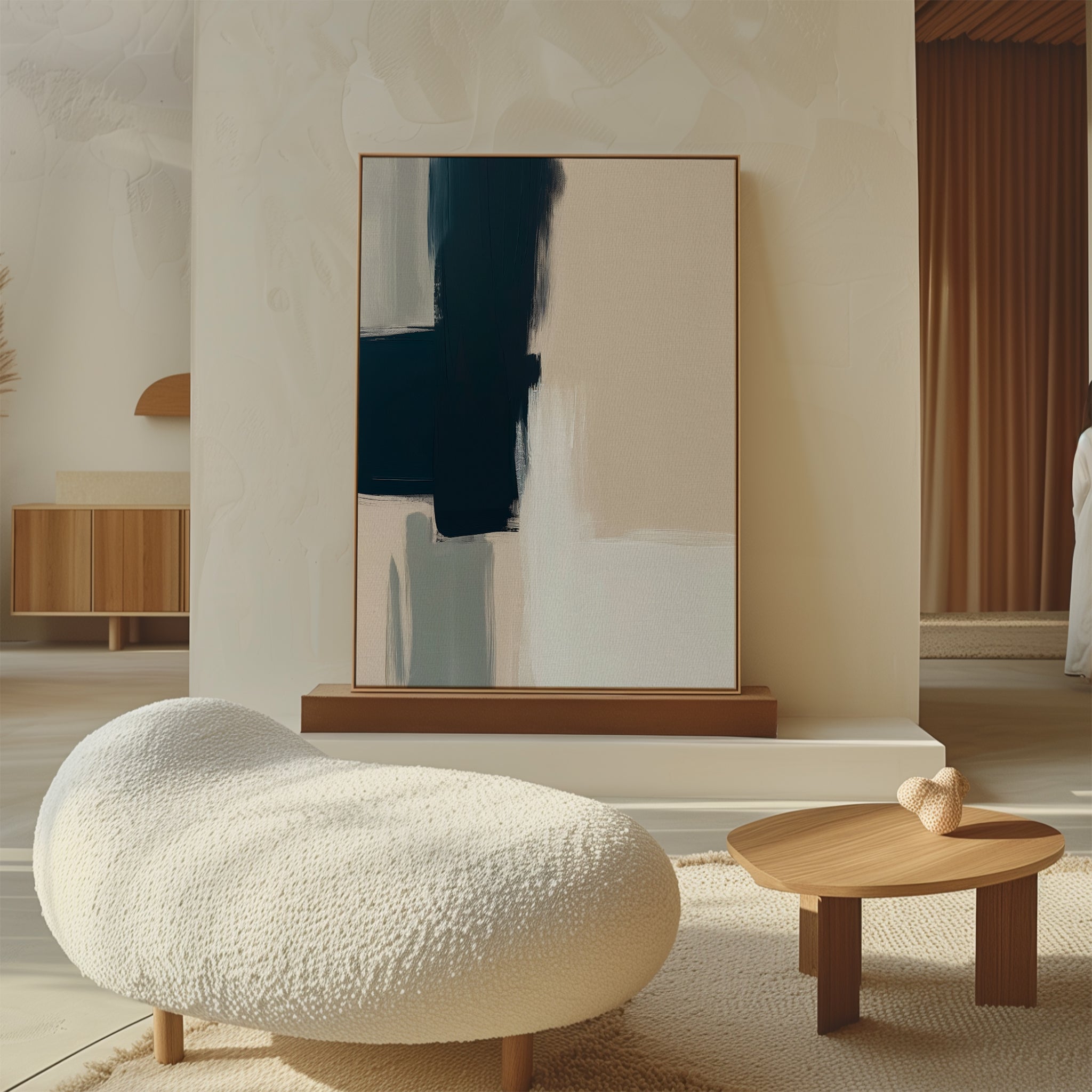 A modern living room with a curved white textured sofa, a small wooden coffee table topped with heart-shaped decor, and the Modern Contrast Abstract Canvas Art featuring dark and light geometric shapes on a stand against a textured wall.