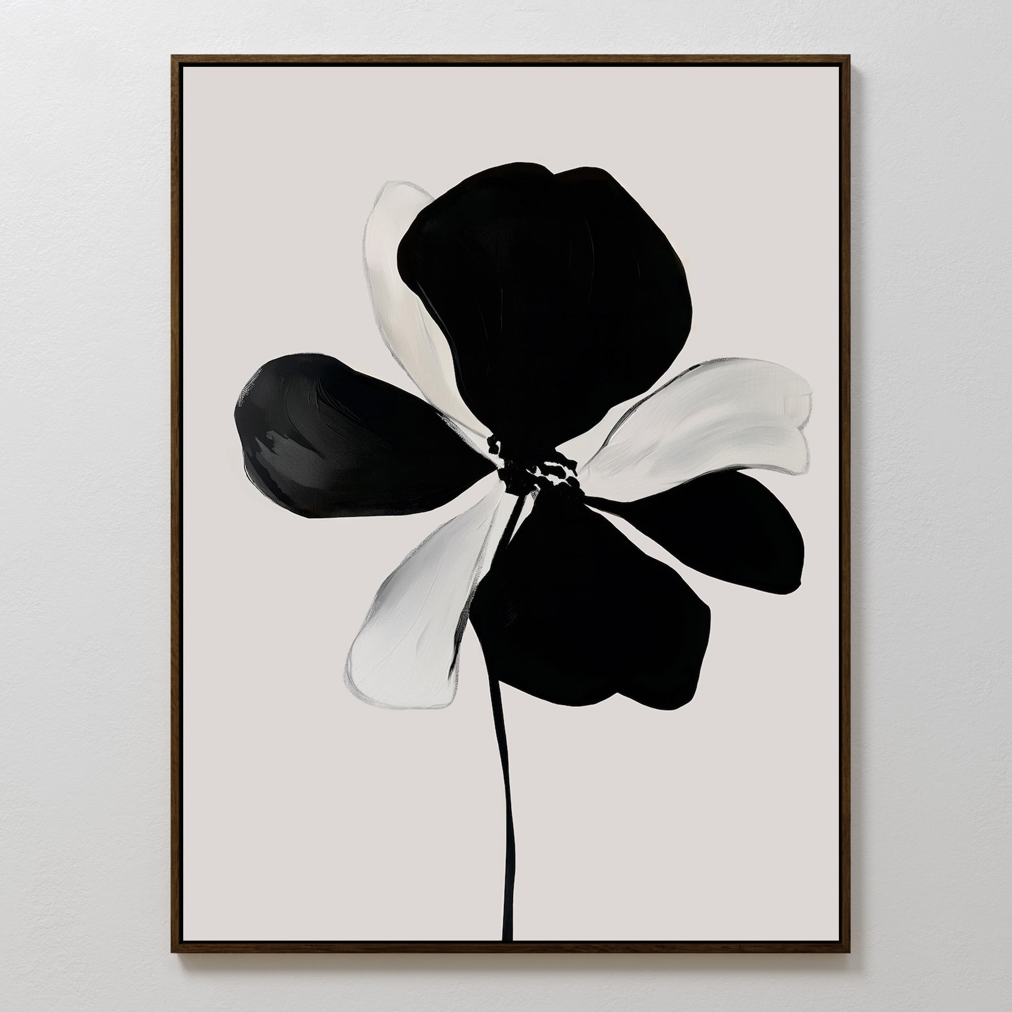The Monochrome Flora Abstract Canvas Art features a single bold black and white flower with striking brushstrokes on a light gray background, framed in a slim dark frame for a simple, modern touch.