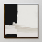 Monochrome Harmony Abstract Canvas Art features a black section on the left, white on the right, and blurred gray transitions. Framed in a thin dark wooden frame, this minimalist modern decor stands out against a white wall.