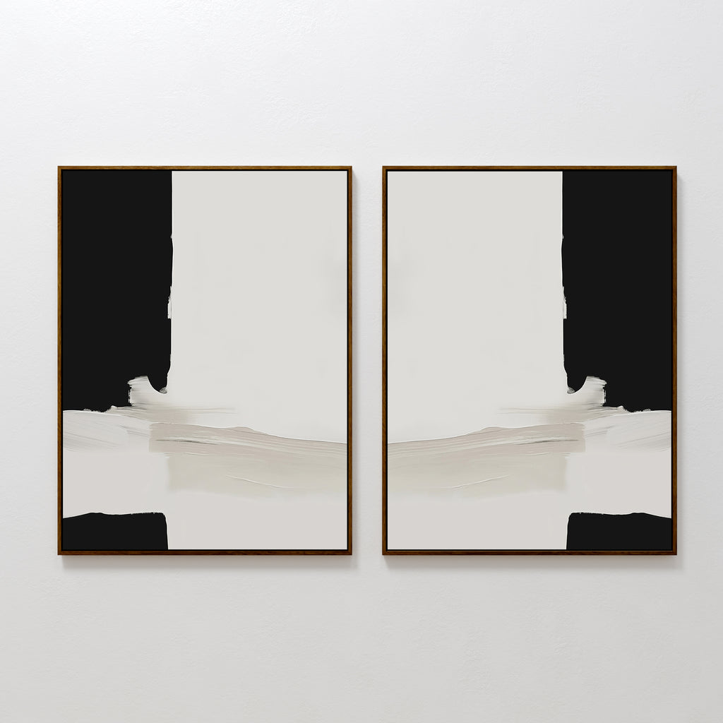 The Monochrome Harmony Set of 2 features abstract art with bold black areas and off-white strokes on white backgrounds, arranged side by side. Each piece is framed in slim, gold frames, offering a modern, mirrored minimalist look.