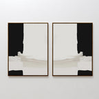 The Monochrome Harmony Set of 2 features abstract art with bold black areas and off-white strokes on white backgrounds, arranged side by side. Each piece is framed in slim, gold frames, offering a modern, mirrored minimalist look.