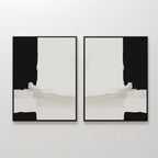 The Monochrome Harmony Set of 2 features bold black forms and pale beige brushstrokes in mirrored compositions, creating striking minimalist wall art with a contemporary aesthetic.