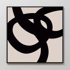 The Monochrome Stream Abstract Canvas Art features bold black intersecting curves on a beige background, adding modern minimalist elegance to any living room when hung on a light wall.