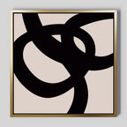 Monochrome Stream Abstract Canvas Art features bold, black interlocking curves on a beige background with a slim metallic gold frame. This minimalist piece adds modern elegance and striking shapes to any living room decor.