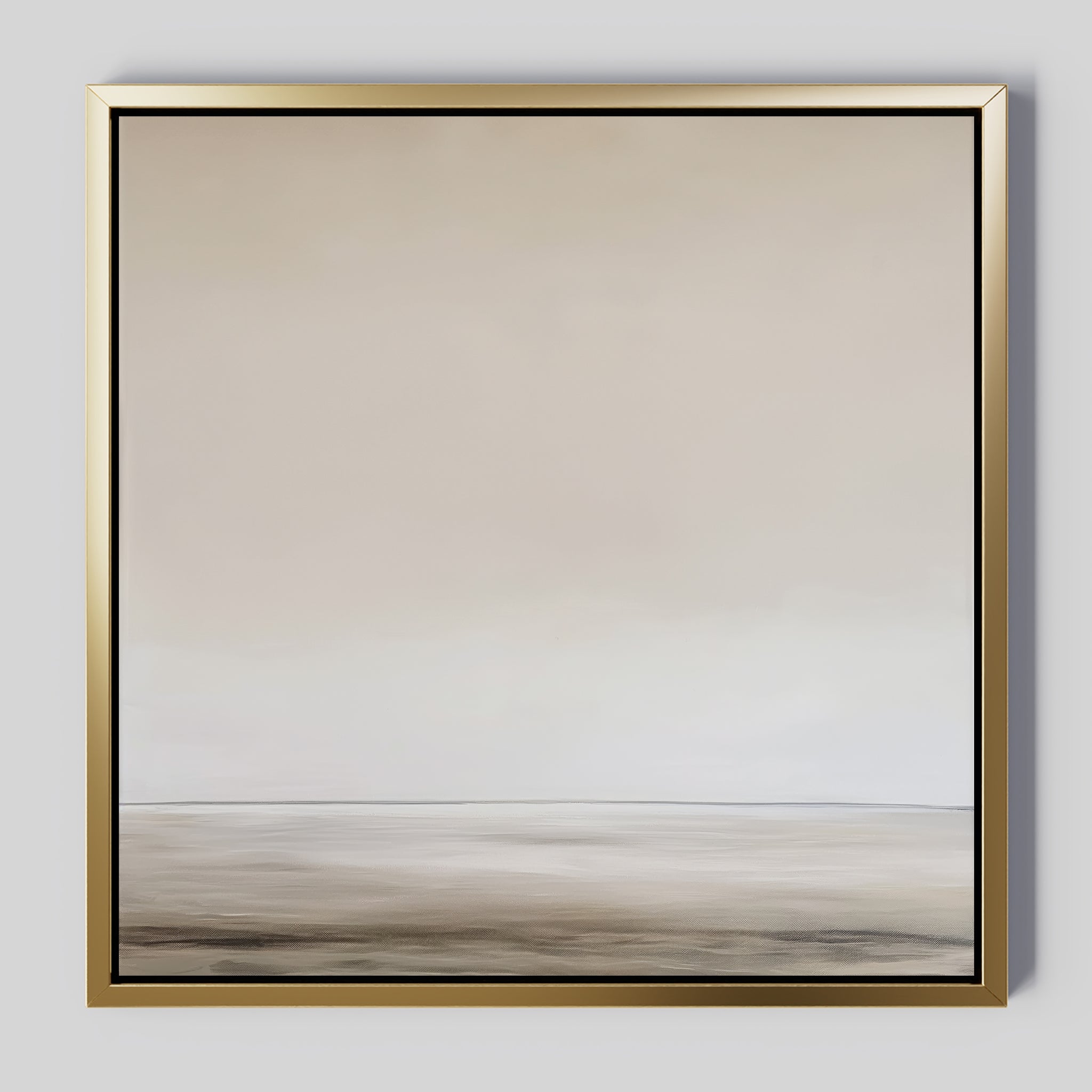 The Morning Mist Abstract Canvas Art features a minimalist landscape with a soft horizon and calming beige and gray tones, all framed in metallic gold for a touch of modern elegance.